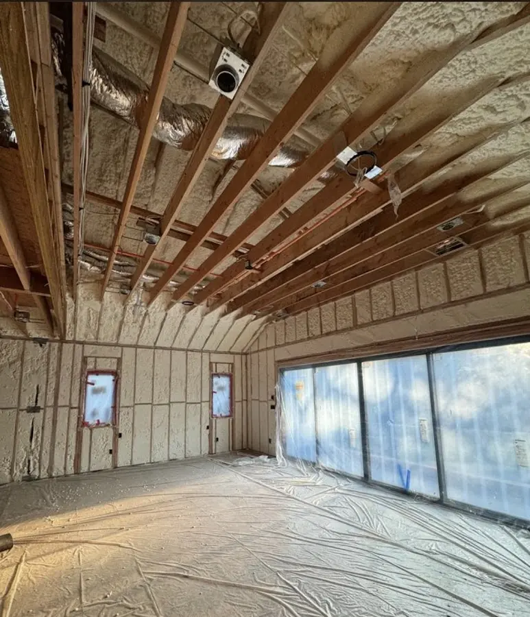 Interior walls and ceiling insulated with spray foam during new construction in Galveston
